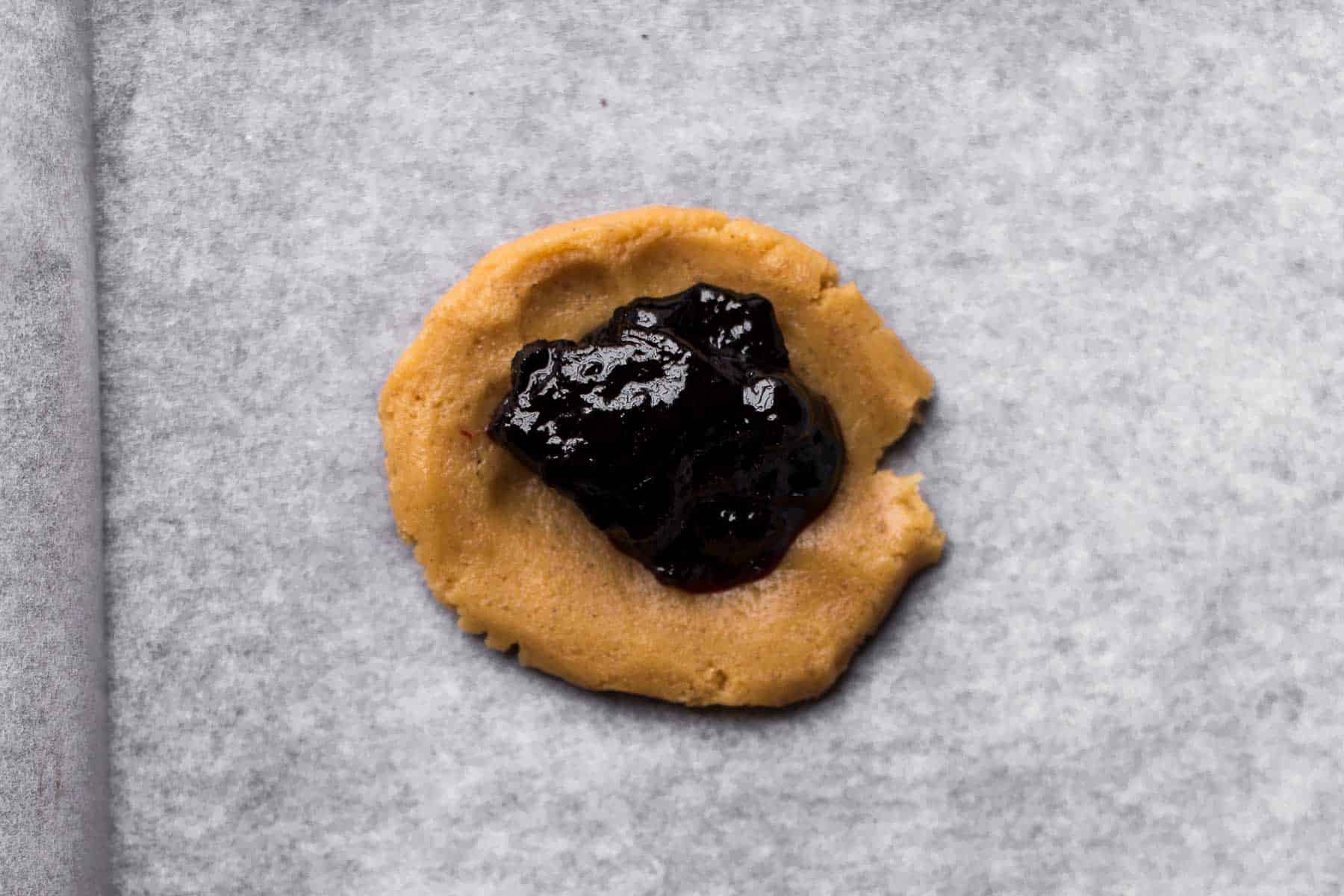 piece of cookie dough filled with jelly