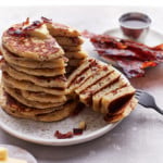 Stack of pancakes with a quarter cut out