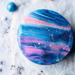 Top view shot of a decorated galaxy cake