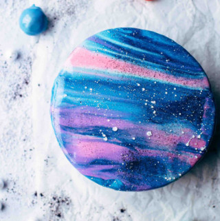 Top view shot of a decorated galaxy cake