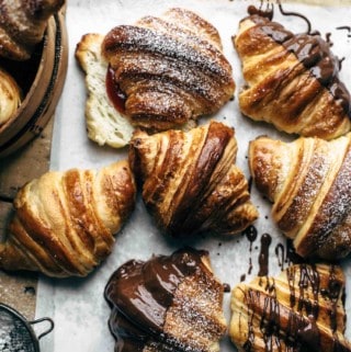Baked croissants on white paper ready to eat