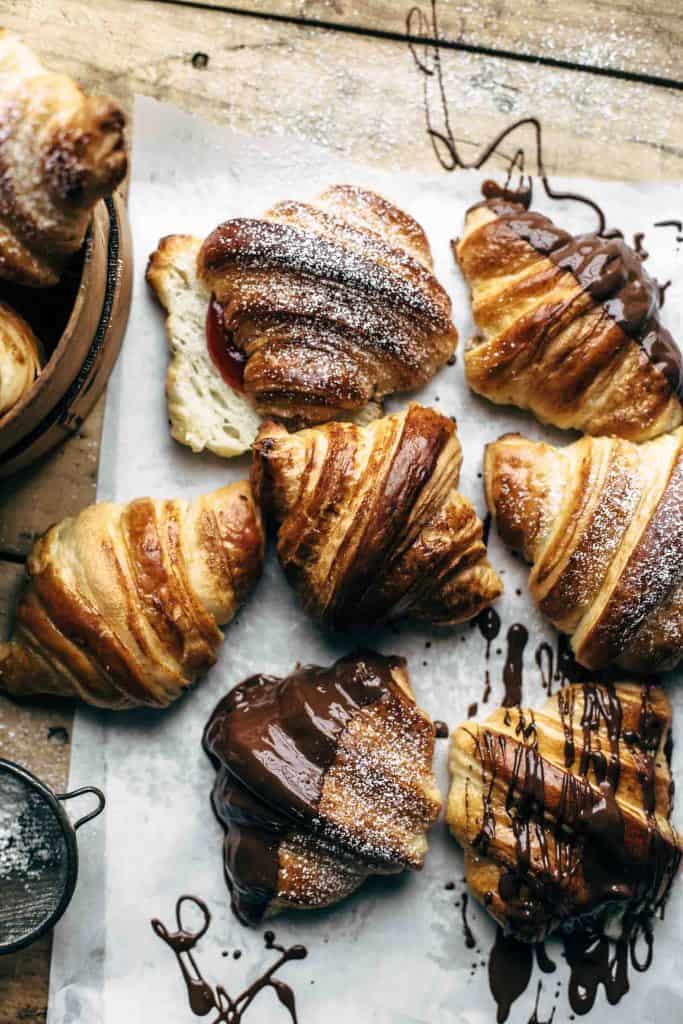 Baked croissants on white paper ready to eat