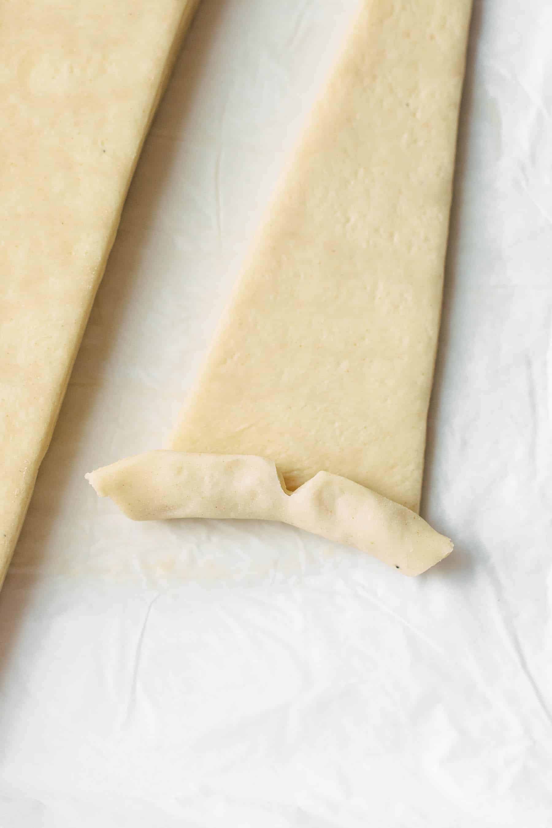 cut puff pastry dough cut into a triangle