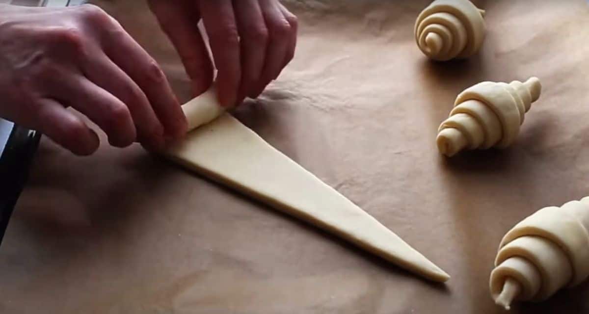 rolling croissant dough triangle