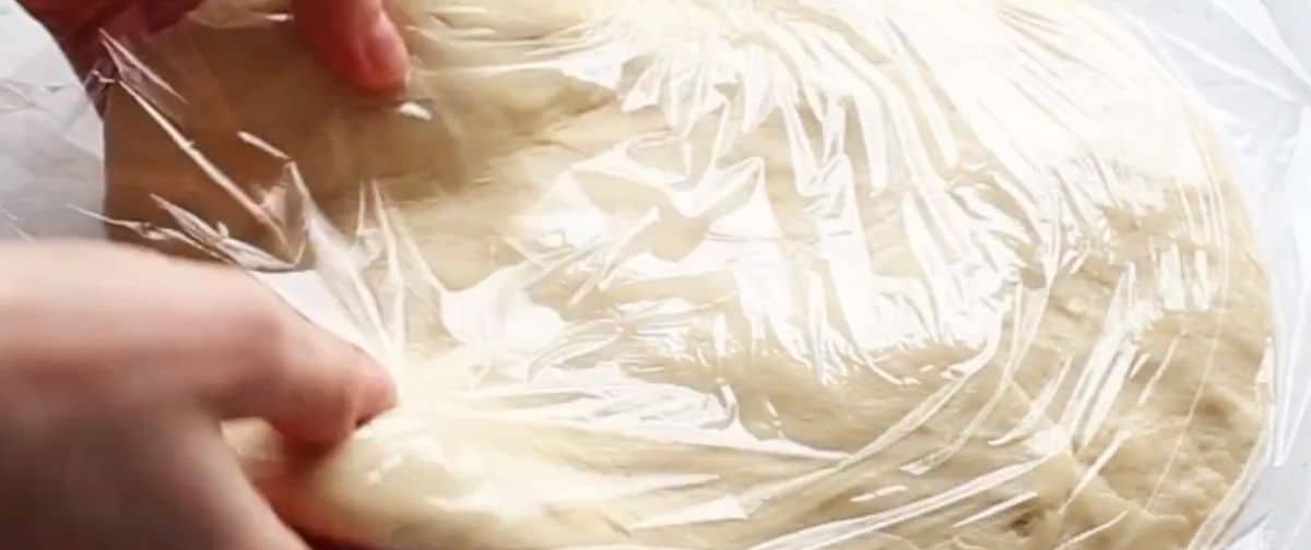 cover croissant dough in cling wrap