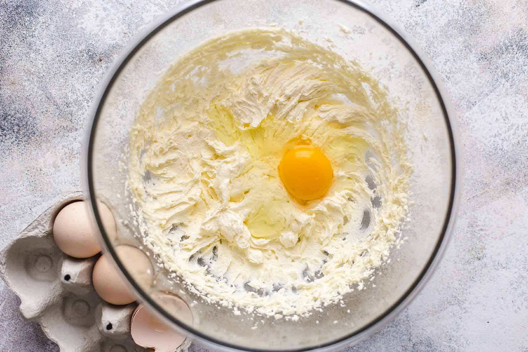 Mixing progress: adding first egg to the batter
