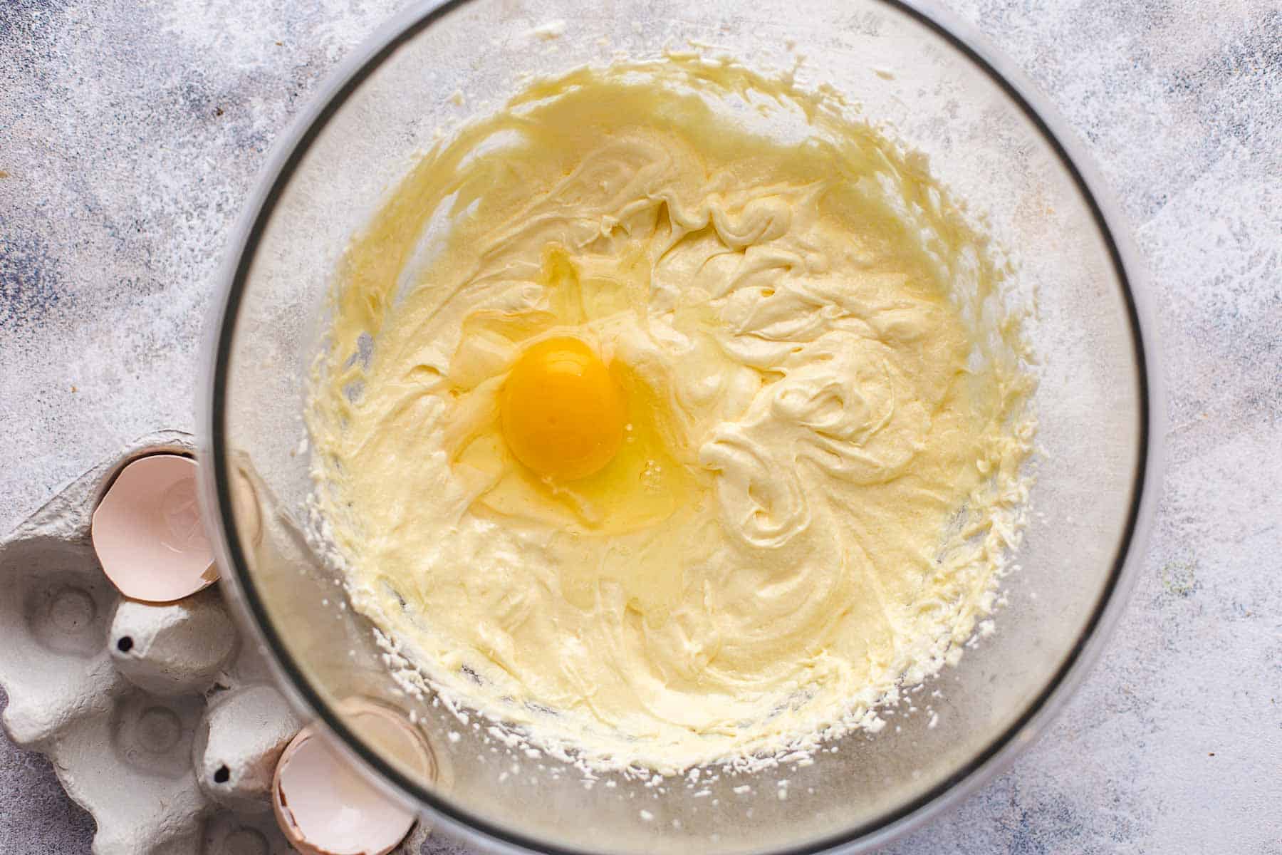 mixed batter with egg on top in a bowl