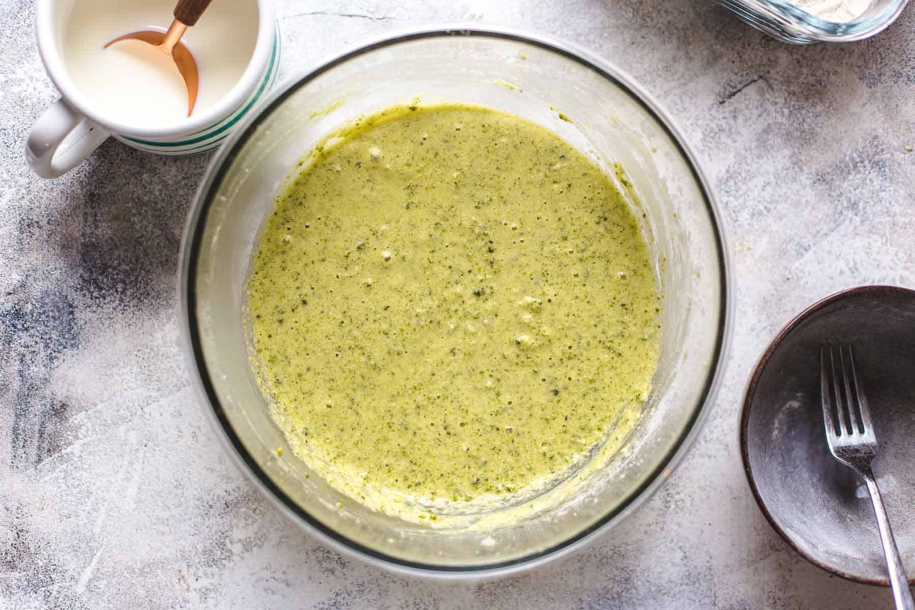 mixed pistachio cake batter in a bowl