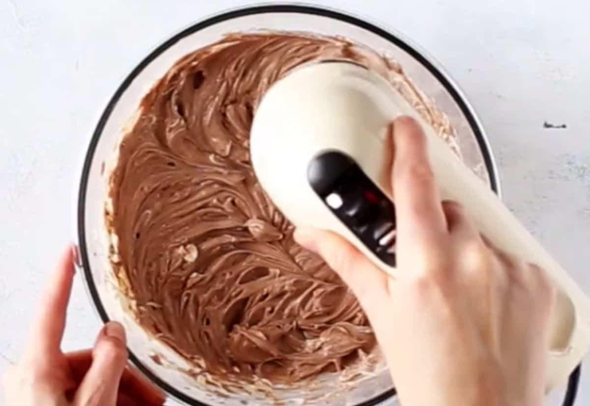 no-bake chocolate cheesecake filling being whisked