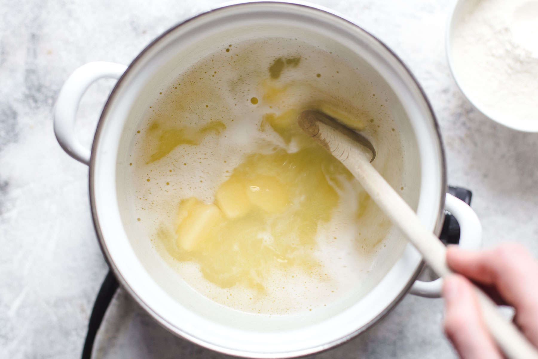 cooking water, butter, sugar, and salt in a pot