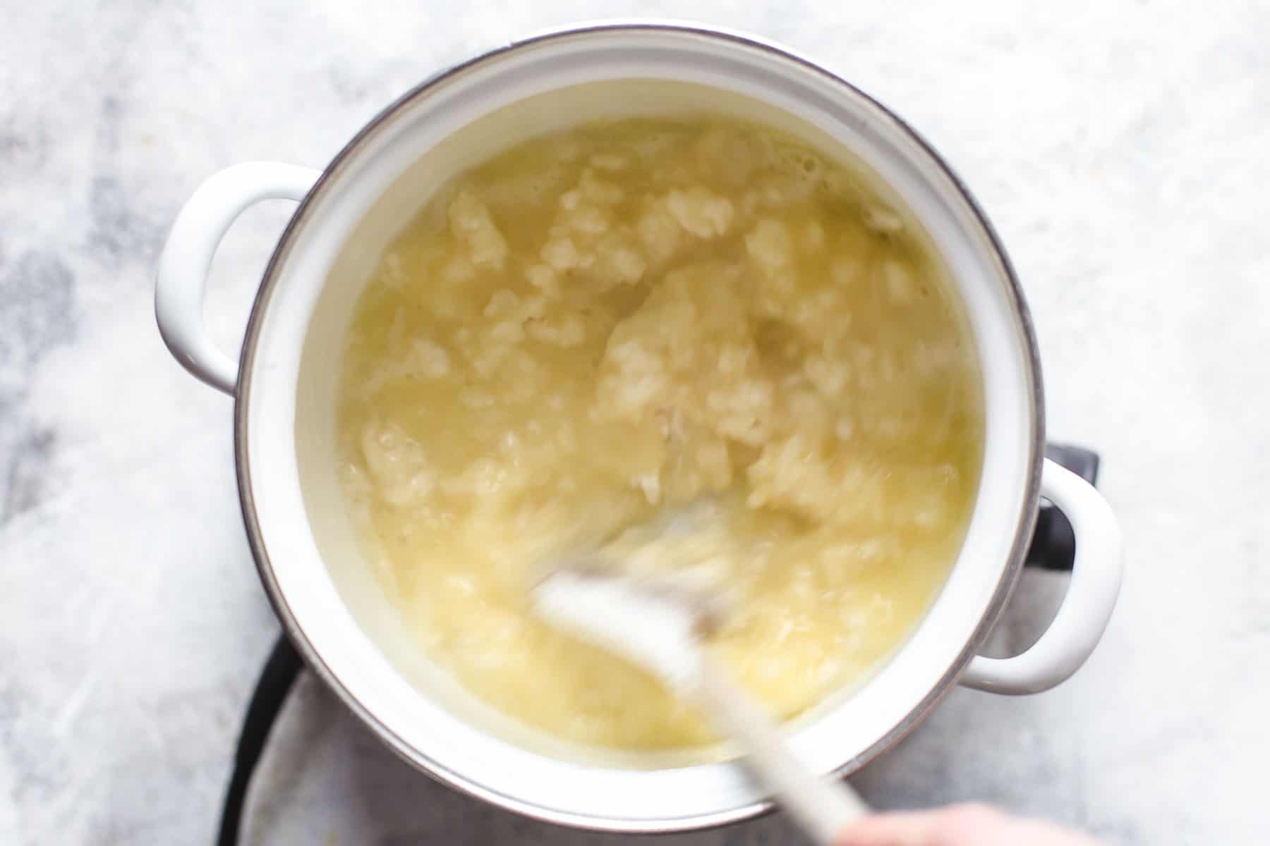 making pate a choux: adding flour to saucepan