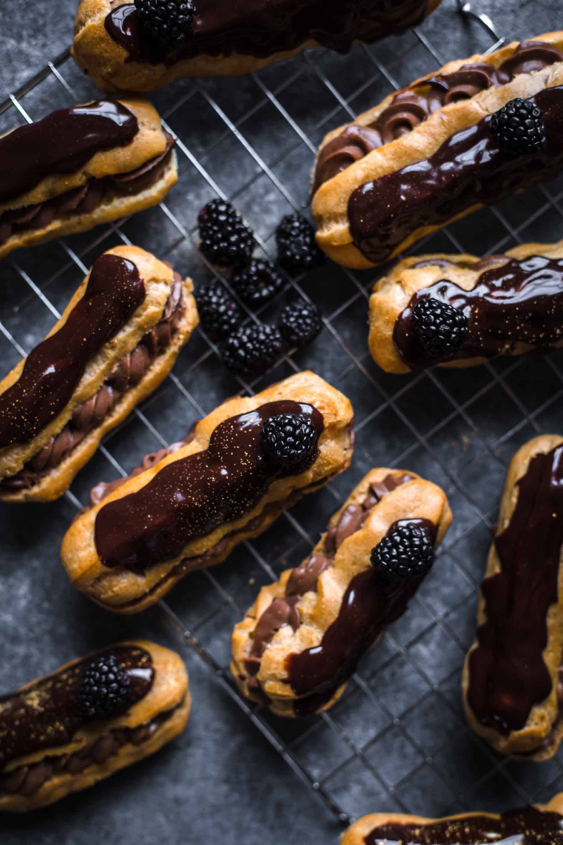 chocolate eclairs on wire rack