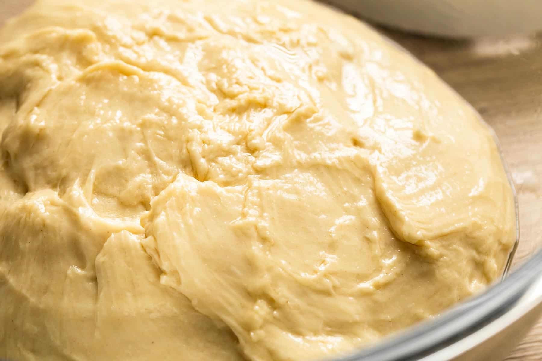 yeast dough with oiled surface in a glass bowl