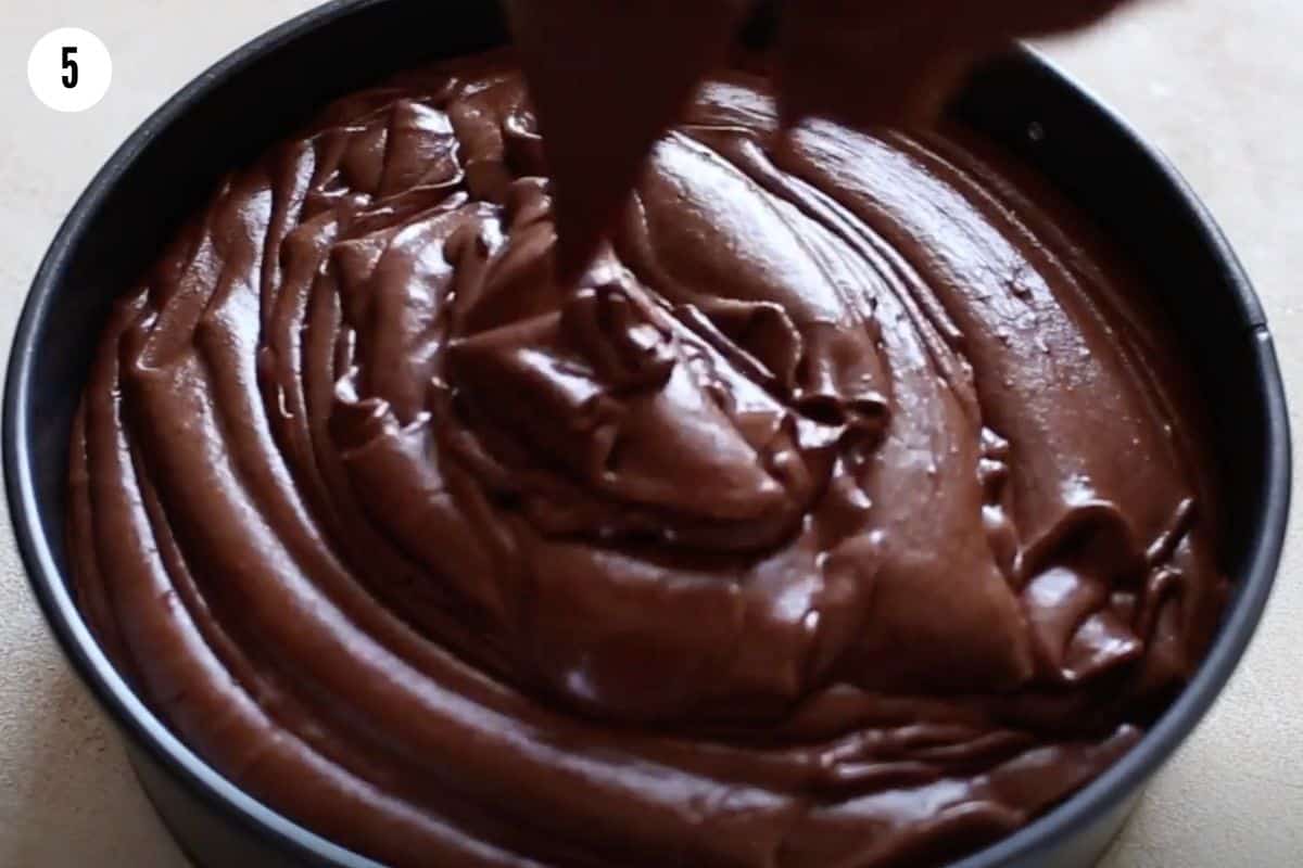 Pouring the chocolate mousse into the pan.