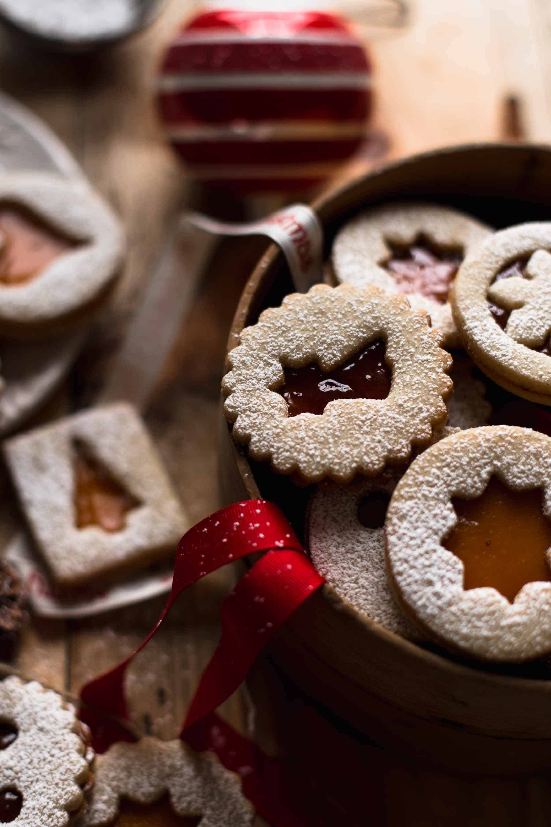 sugar dusted Linzer cookie sandwiches with festive decoration