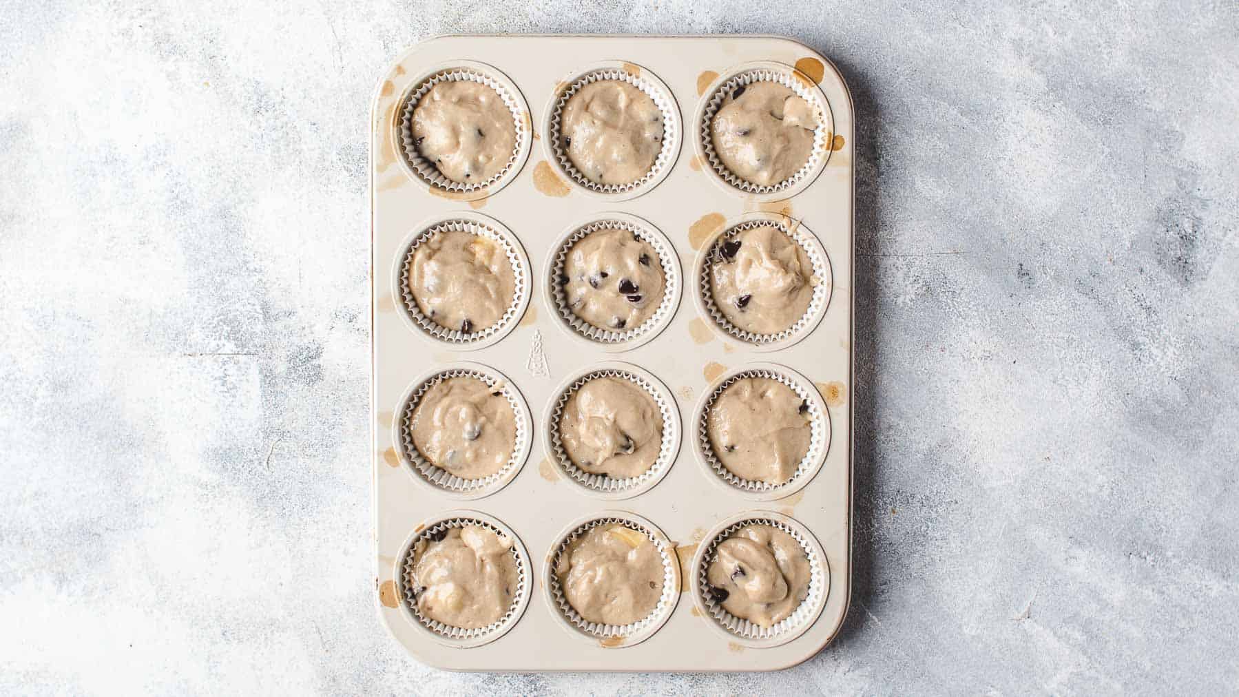 Banana Chocolate Chip Muffins Batter in a muffin pan