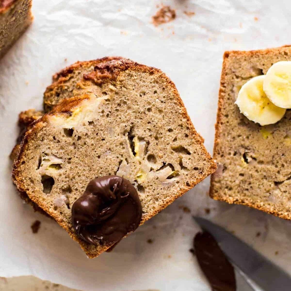 slices of banana bread with a dollop of chocolate spread and banana slices