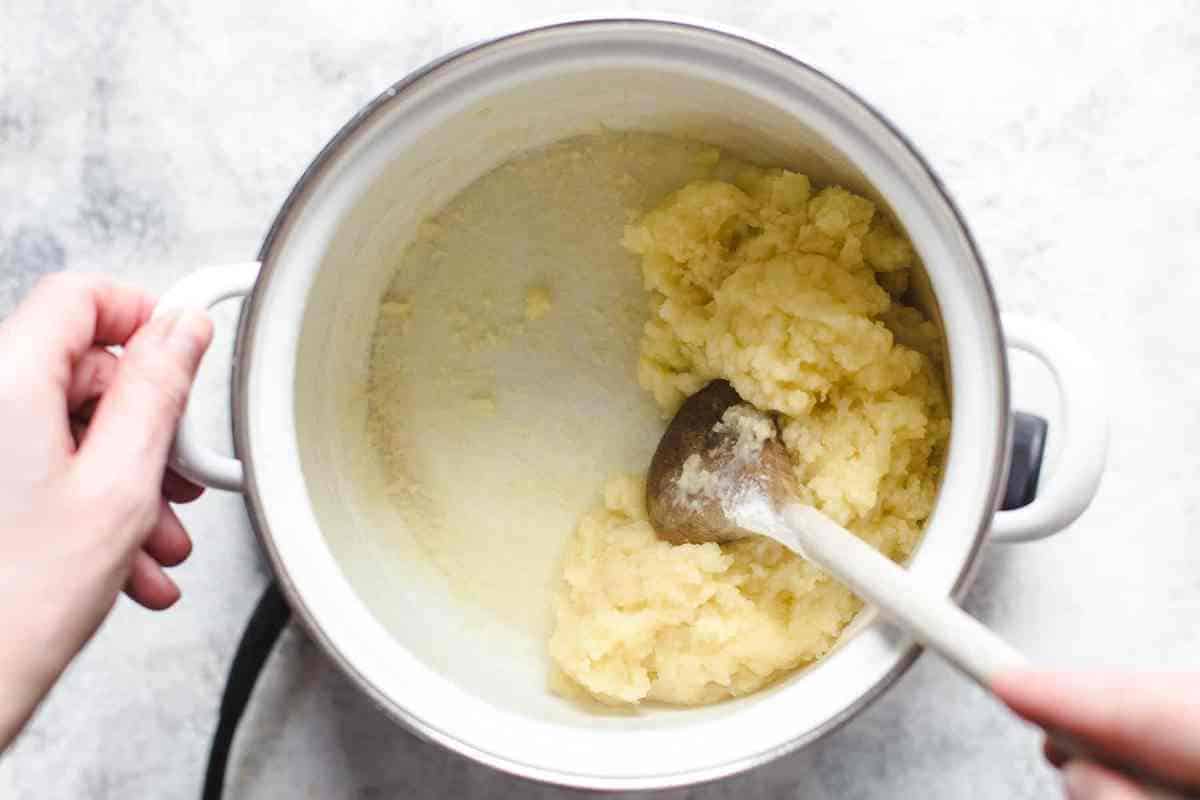 making pate a choux: cooking dough in saucepan