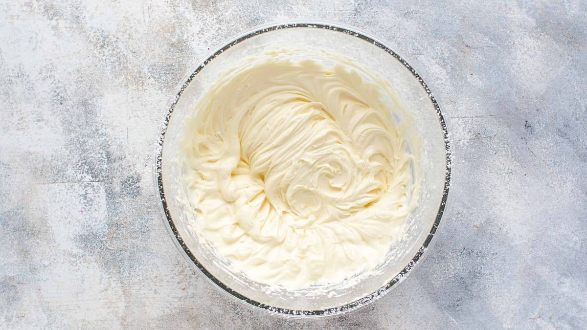 Mixed lemon cream cheese frosting in bowl