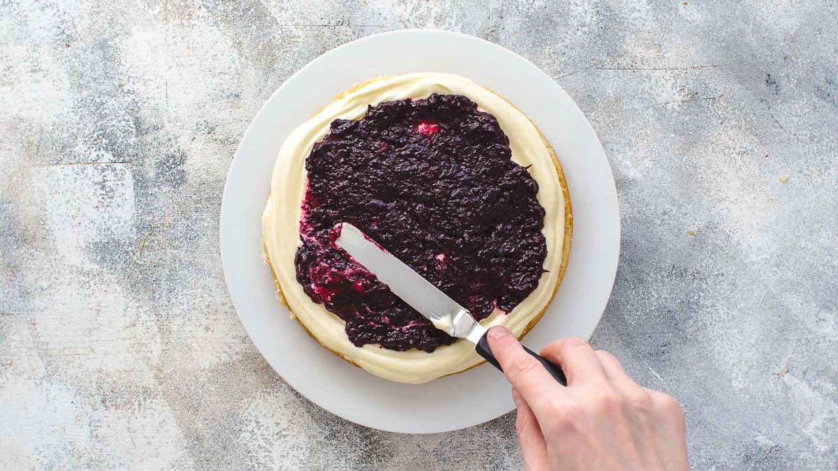 Filling cake with blueberry frosting
