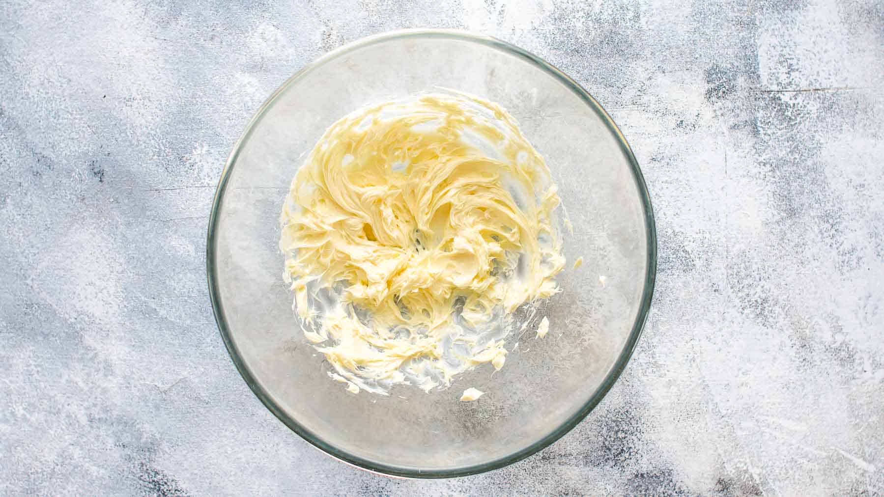 Mixed butter for coconut frosting in large mixing bowl
