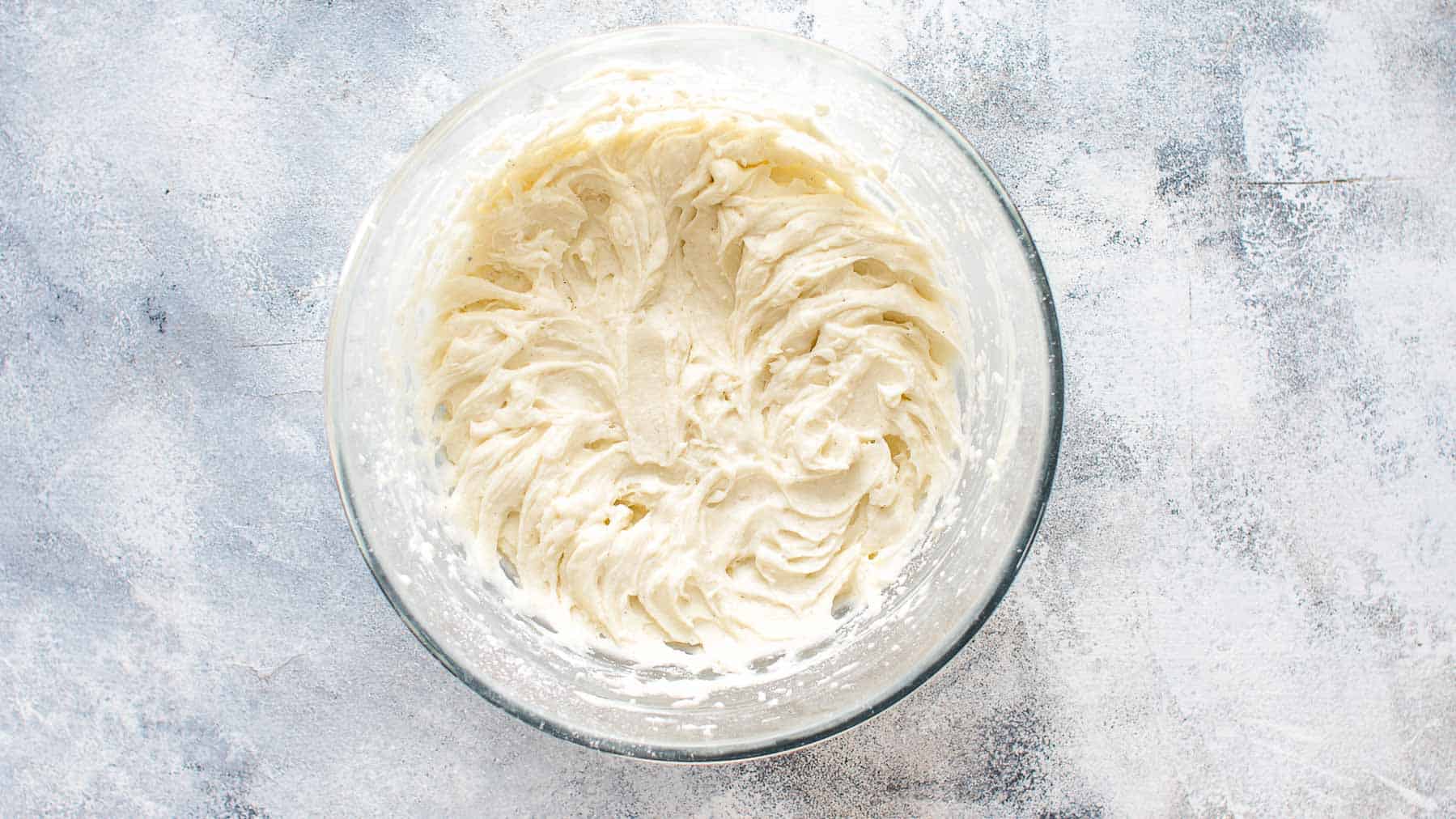Mixed coconut frosting in large mixing bowl