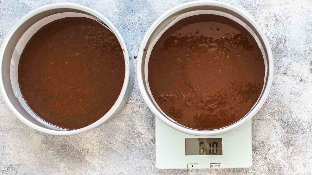 Measuring the chocolate cake batter on kitchen scale