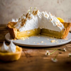 Lemon Meringue Tart on serving plate with a third missing