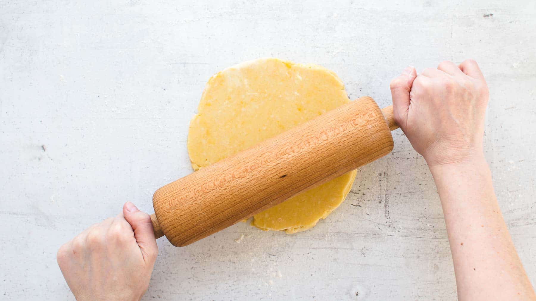 Rolling out pie crust with a rolling pin