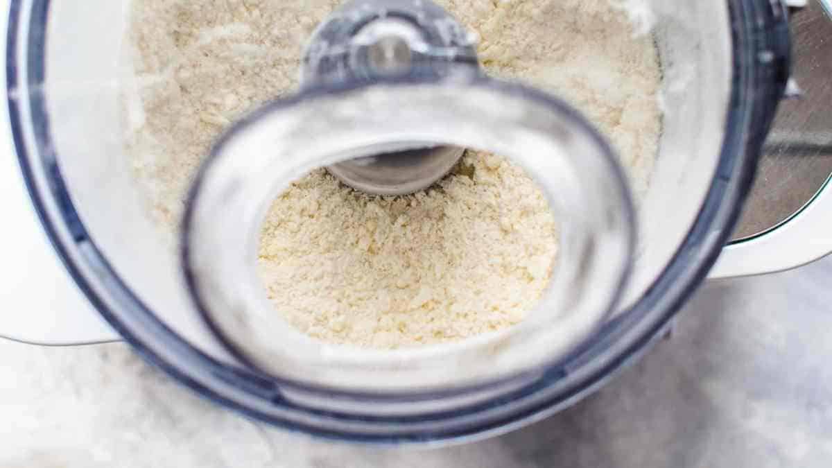 Flour, sugar, salt, and butter processing in food processor