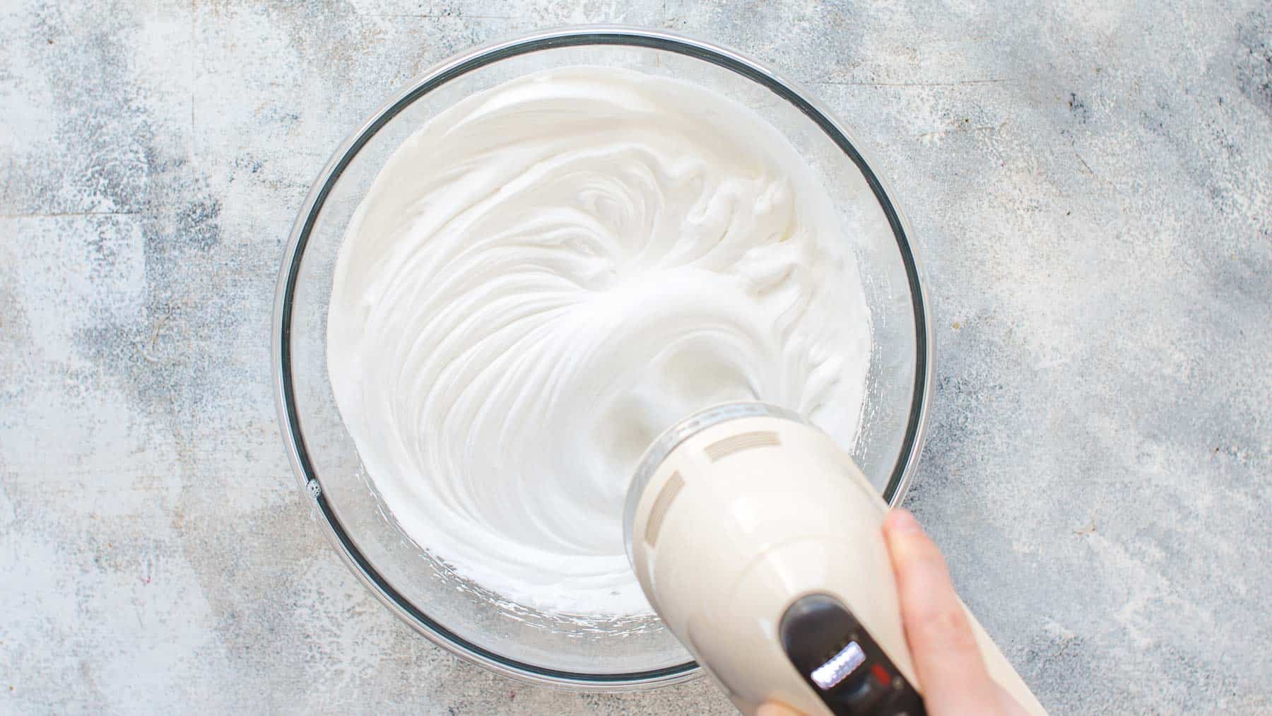 mixing meringue in mixing bowl