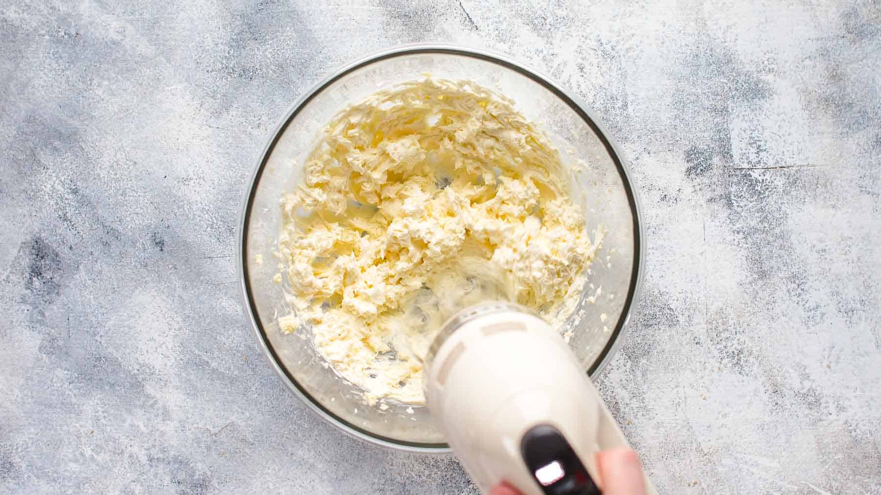 mixing cream cheese and butter in mixing bowl