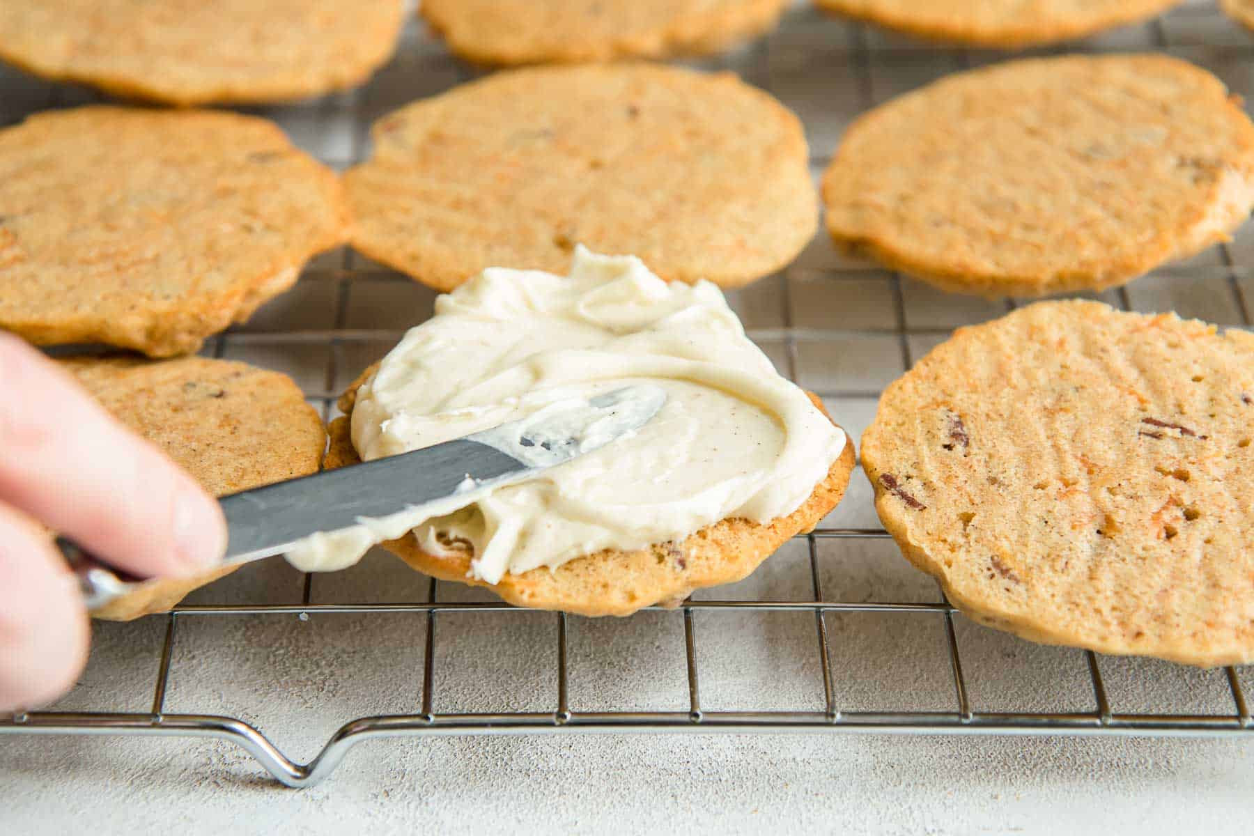 Filling cookies with frosting using a knife