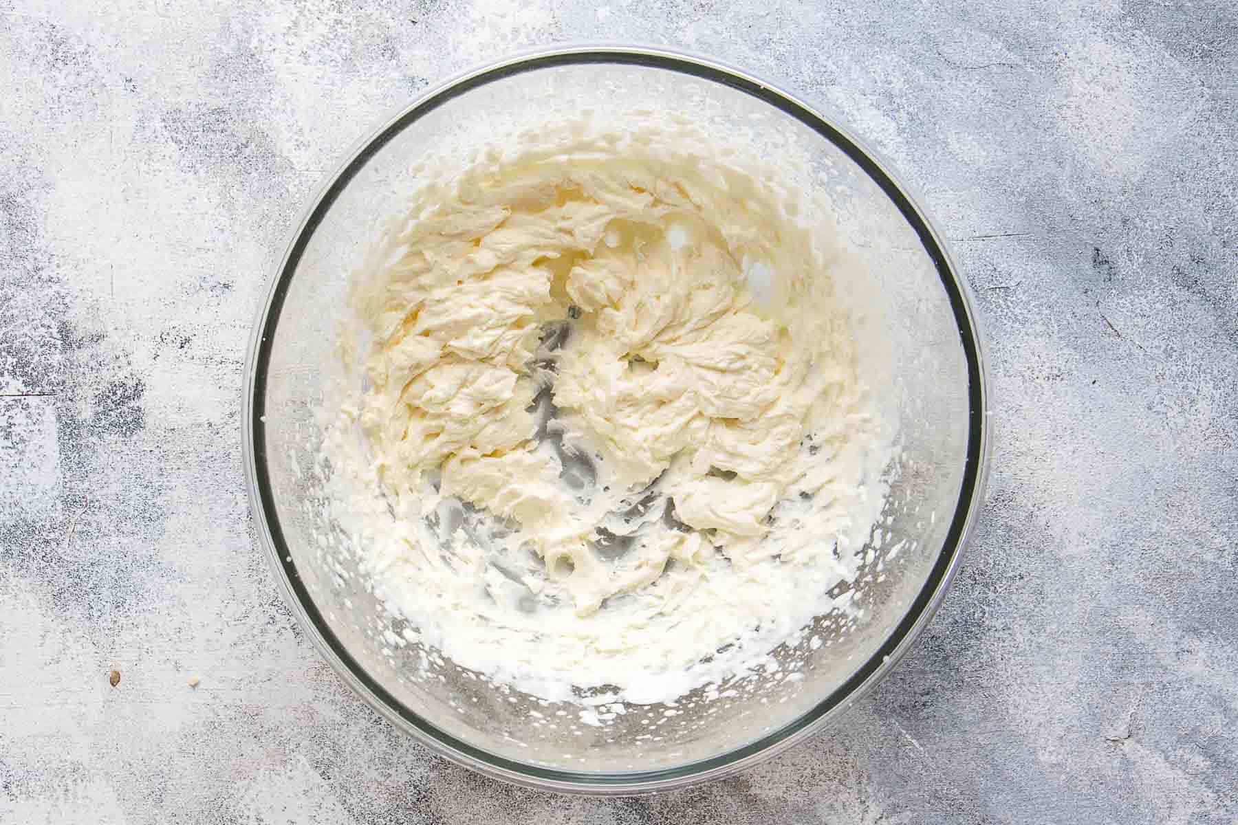 whipped cream in mixing bowl that forms stiff peaks