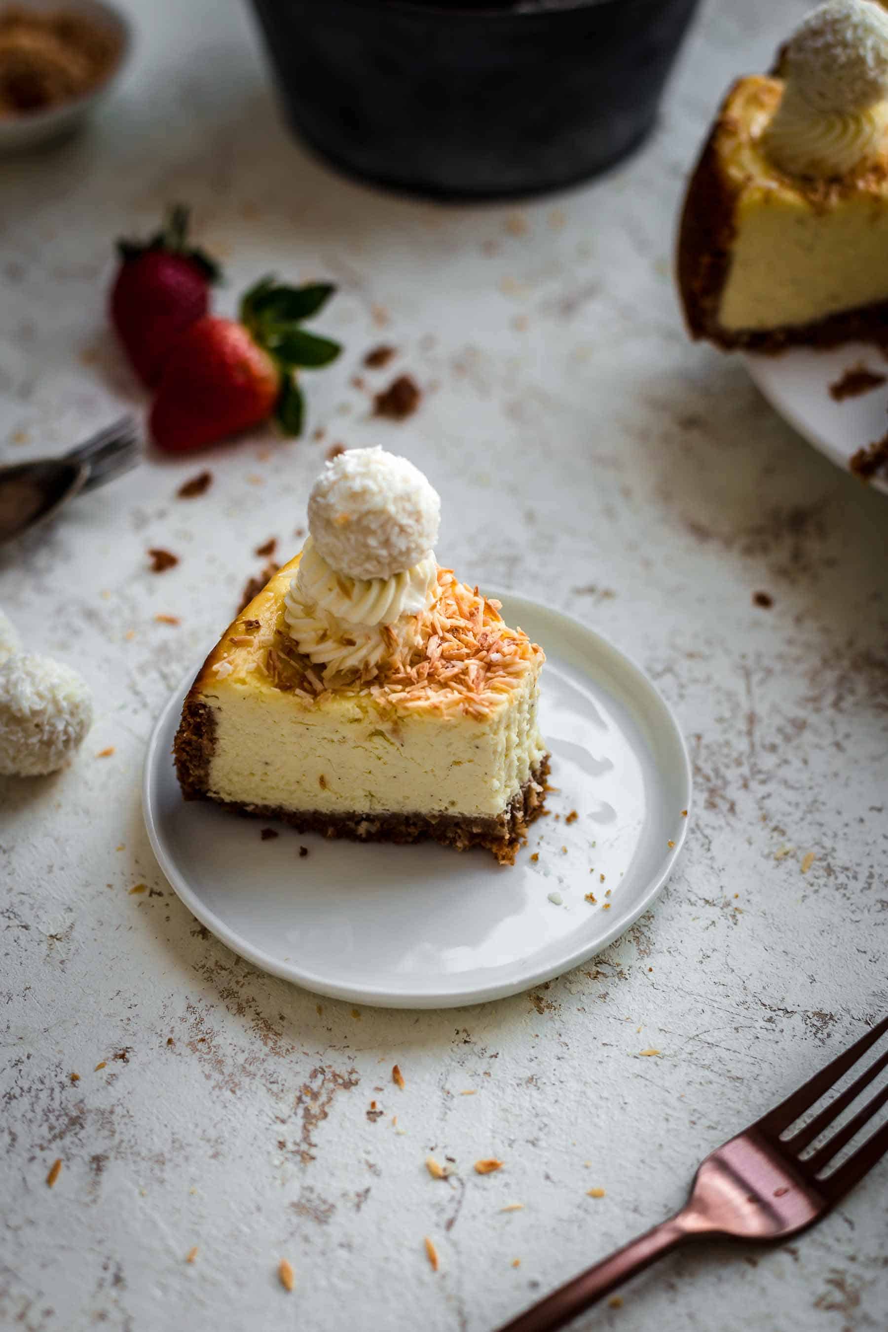 Bitten Coconut Cheesecake on serving plate