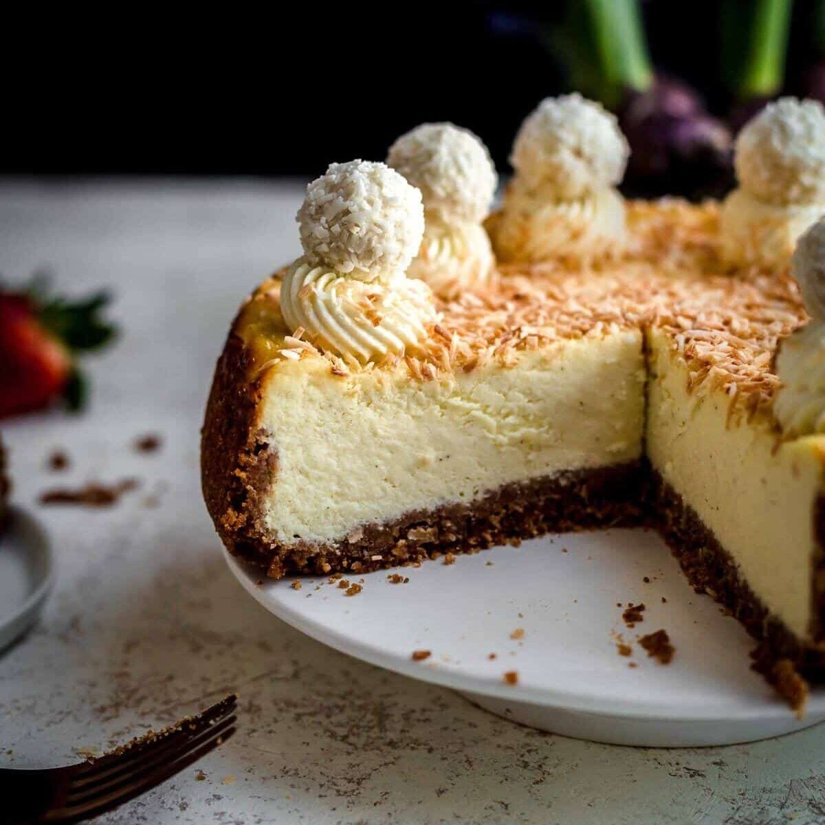 Cut Coconut Cheesecake on serving plate