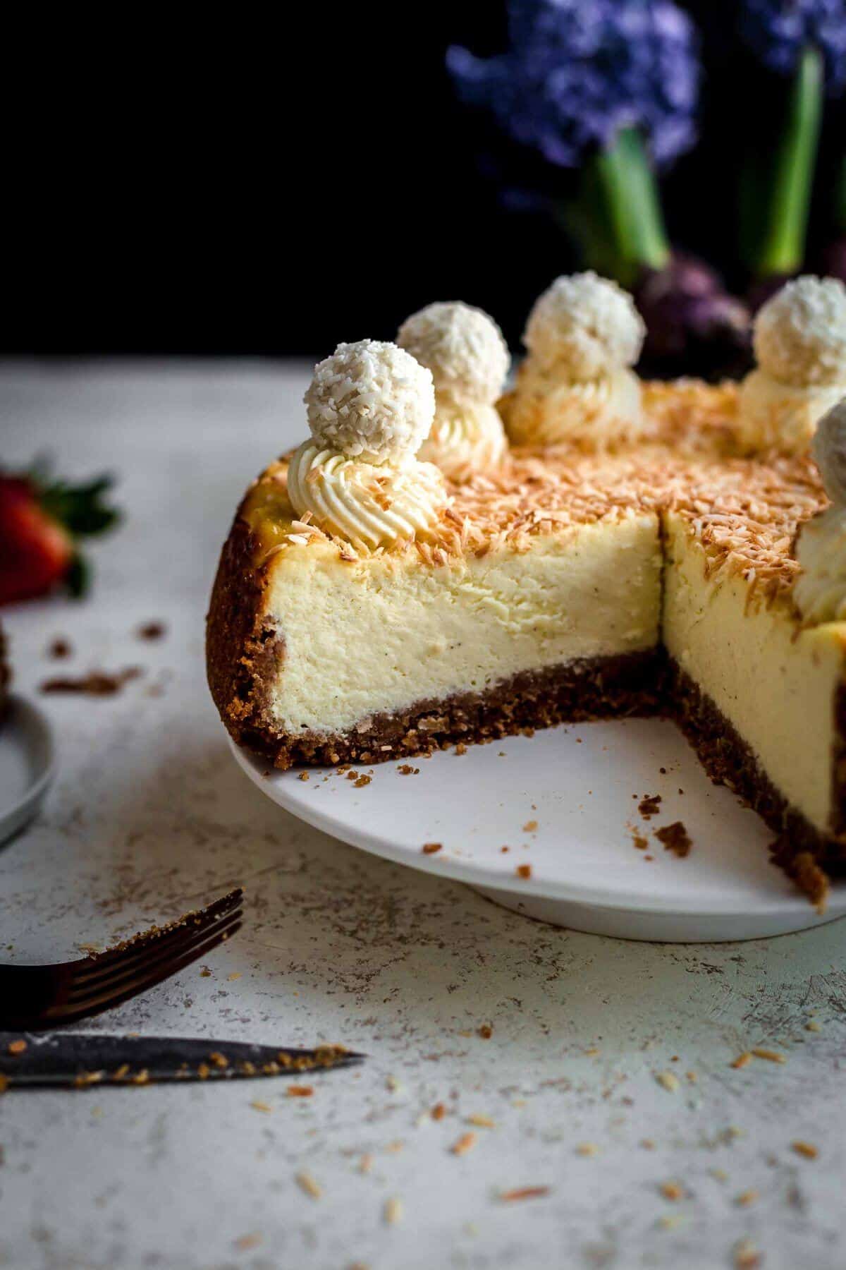 Cut Coconut Cheesecake on serving plate