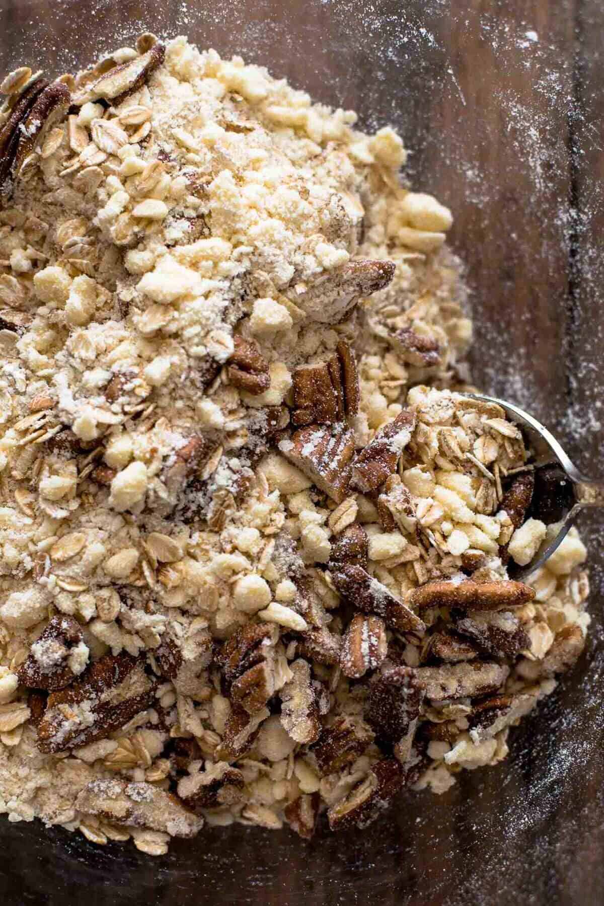 Strawberry Rhubarb Crisp Crust combined with pecans and oats in large mixing bowl