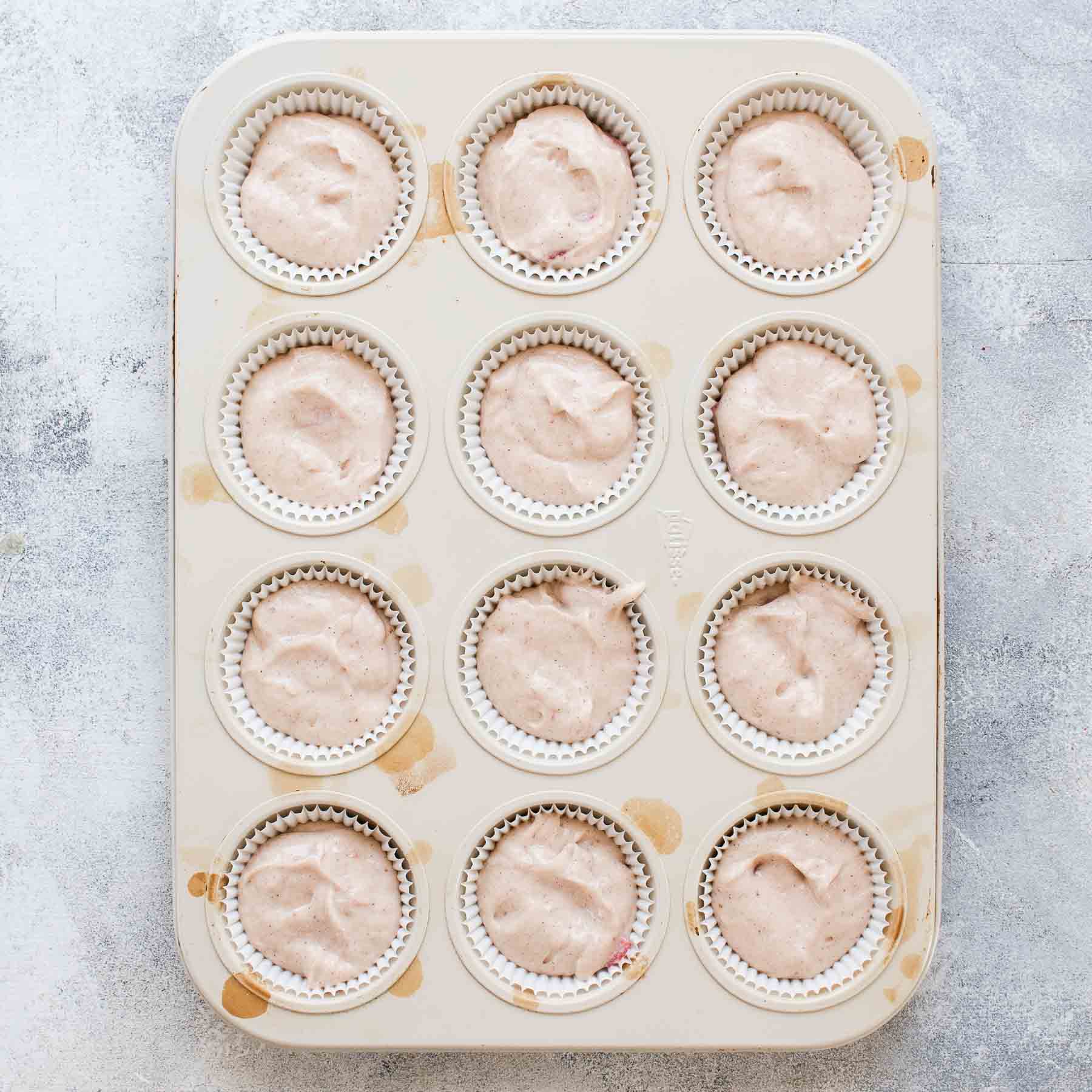Strawberry cupcakes batter in muffin pan