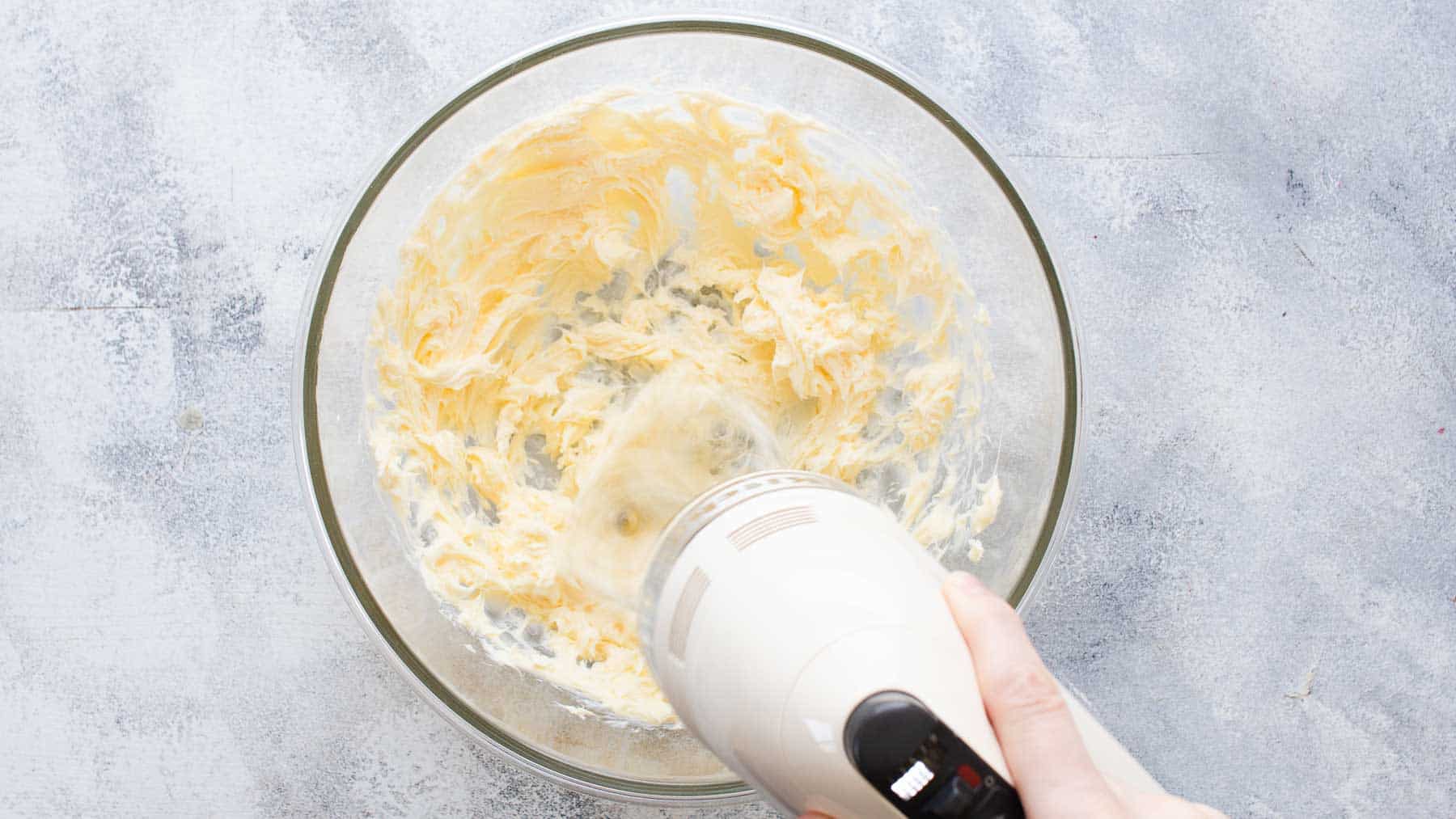 Mixing butter in mixing bowl