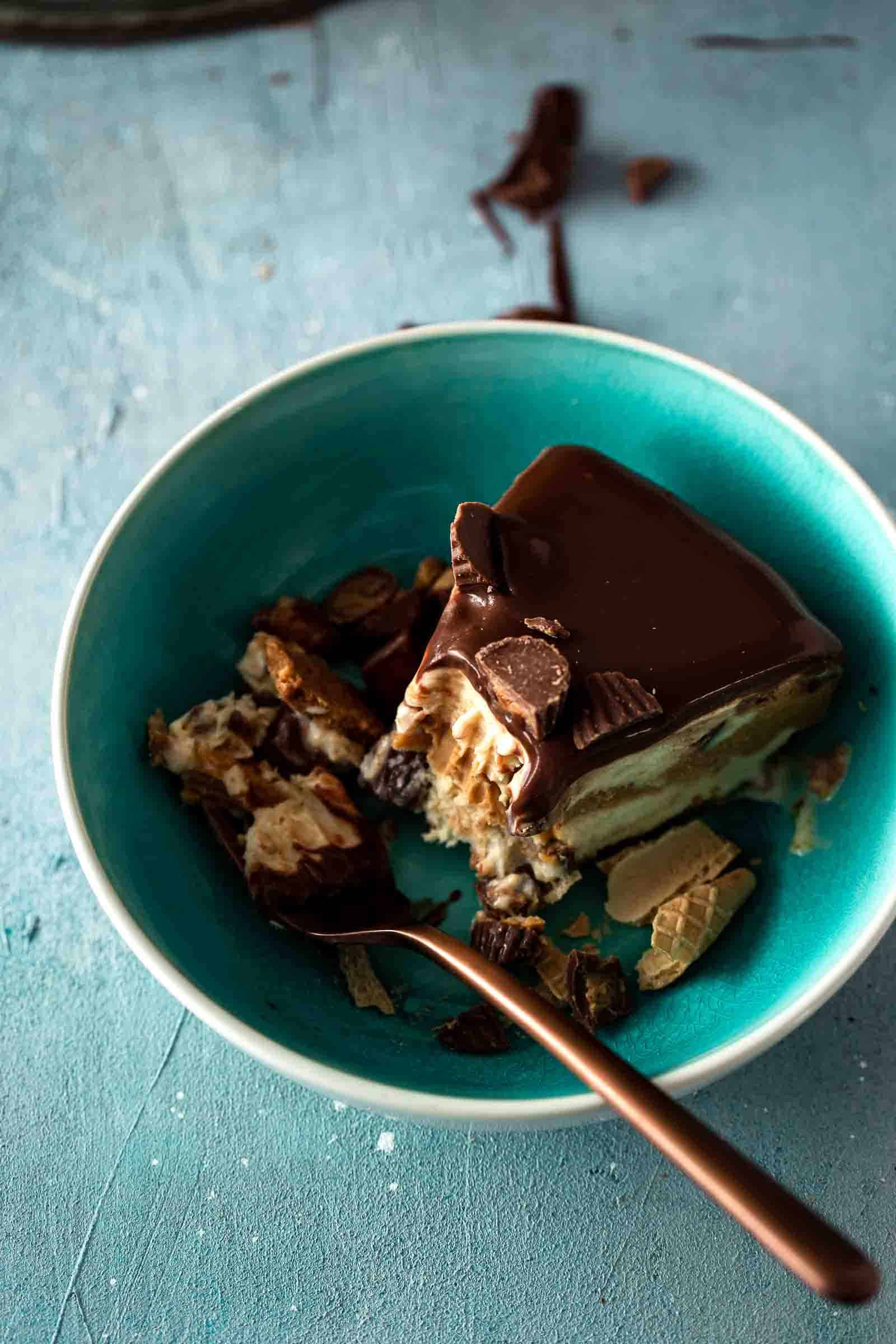 bowl of ice cream cake with a bite on fork
