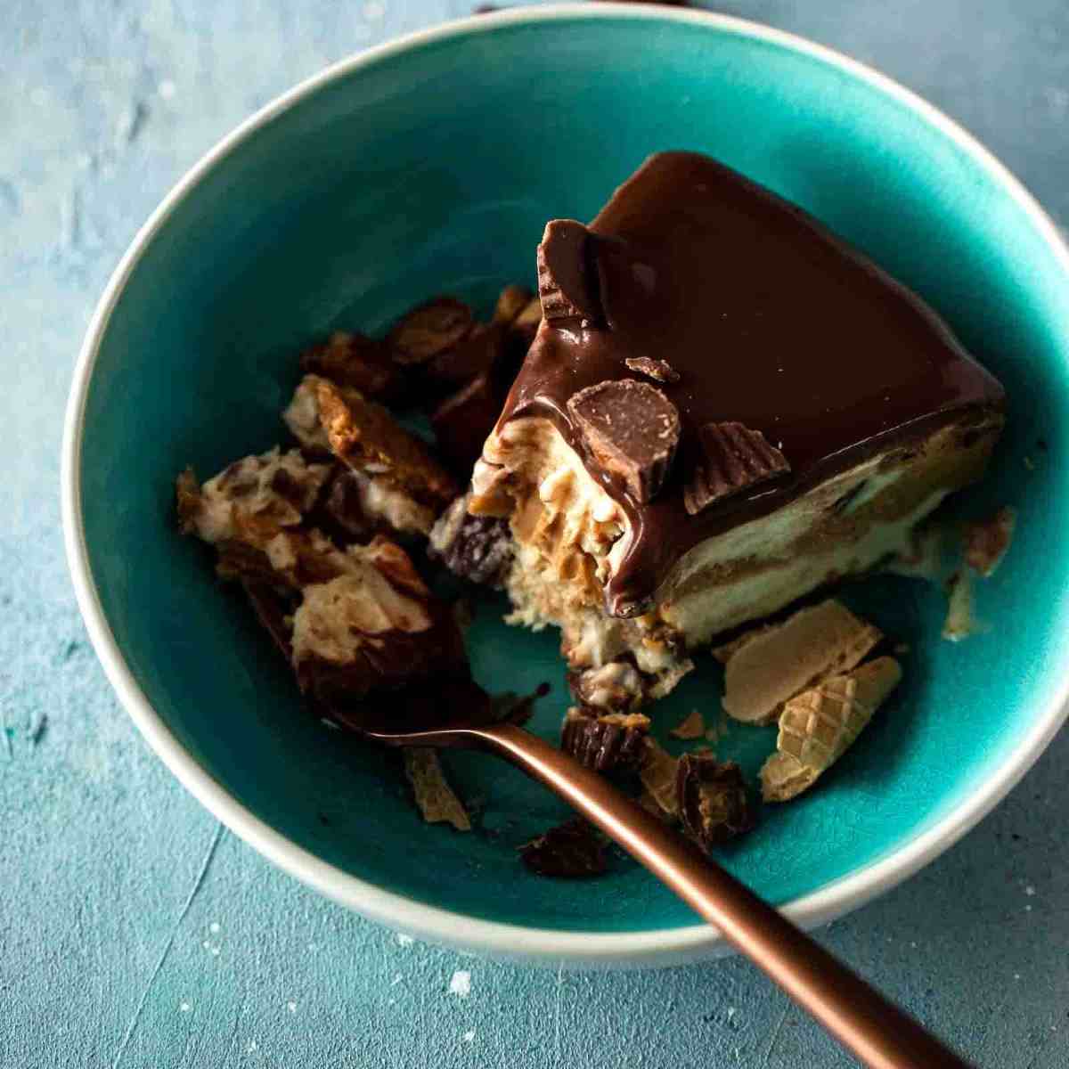 bowl of ice cream cake with a bite on a fork