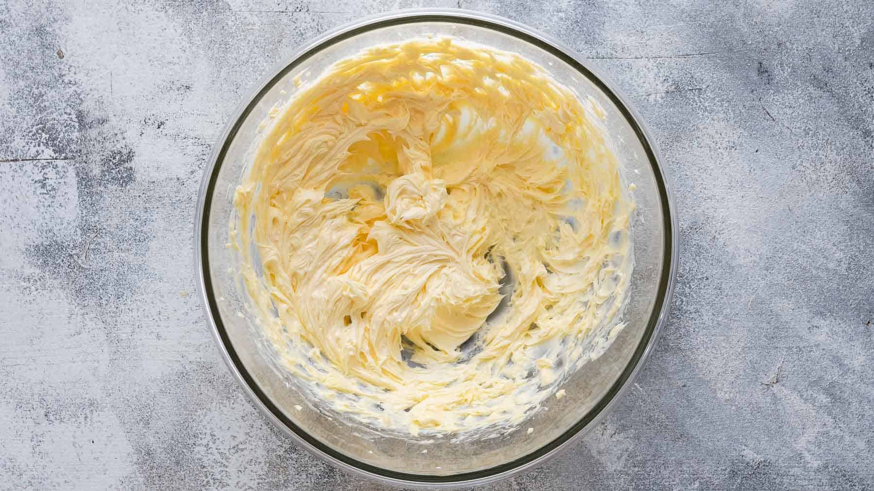 beaten butter in a glass bowl