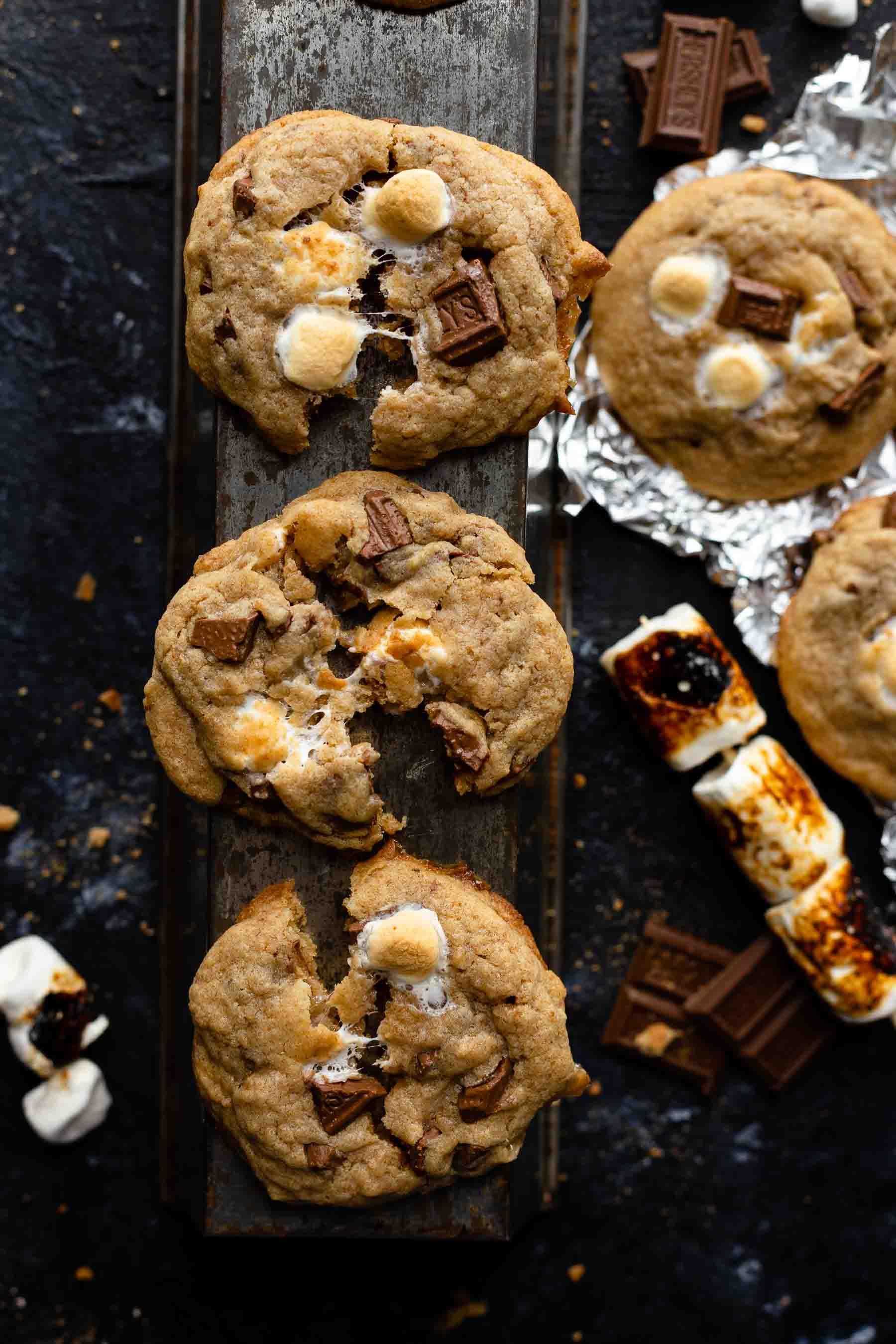 s'mores cookies on table with chocolate by it