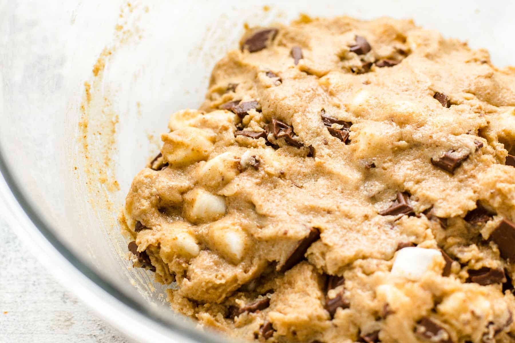 s'mores cookie batter in a glass bowl