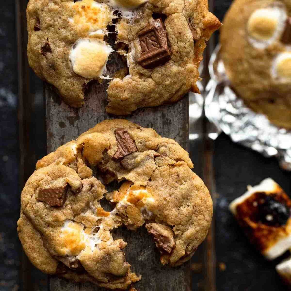 s'mores cookies on table with chocolate by it