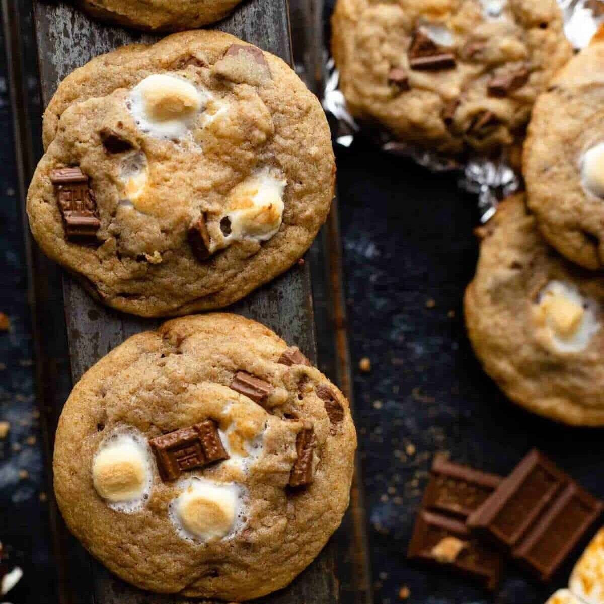 s'mores cookies on table with chocolate by it