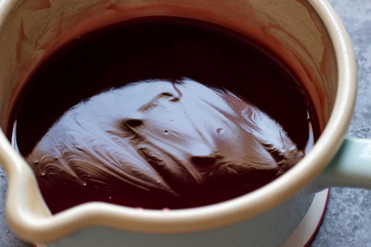 Cooked cherry syrup in a pan