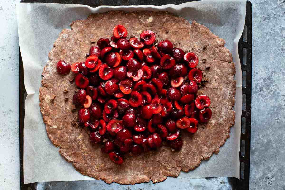 cherries on top of a chocolate pie crust