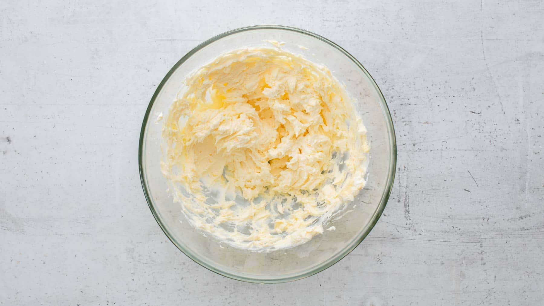 whipped butter and cream cheese in glass bowl